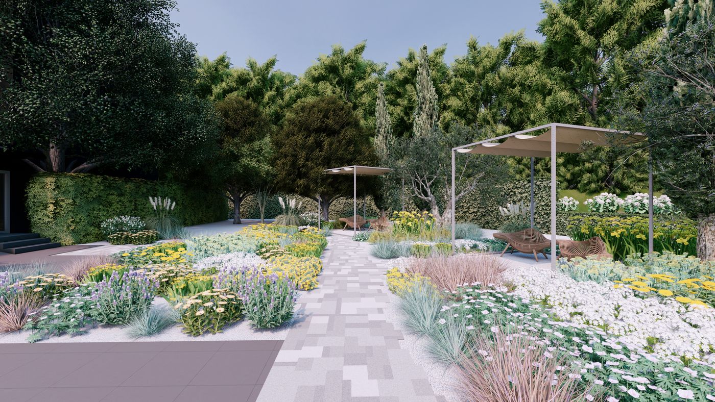Un giardino mediterraneo con percorso in pietra, graminacee e fioriture bianche